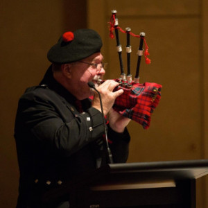 A man playing the bagpipes